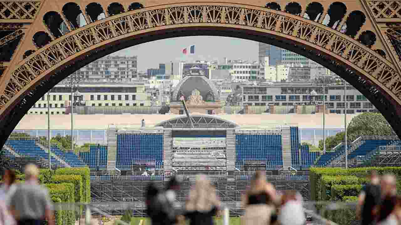 This photograph taken on June 4, 2024 shows the construction site of the Eiffel Tower Stadium that will host the Beach Volleyball and men's Blind Football competitions during the upcoming Paris 2024 Olympics at the Champ-de-Mars garden in Paris. (Photo by Sami KARAALI / AFP) 